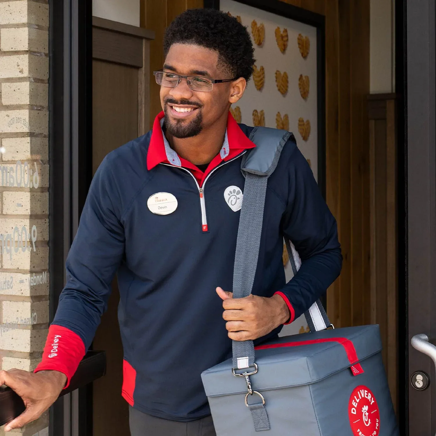 A Chick-fil-A team member ready to welcome guests