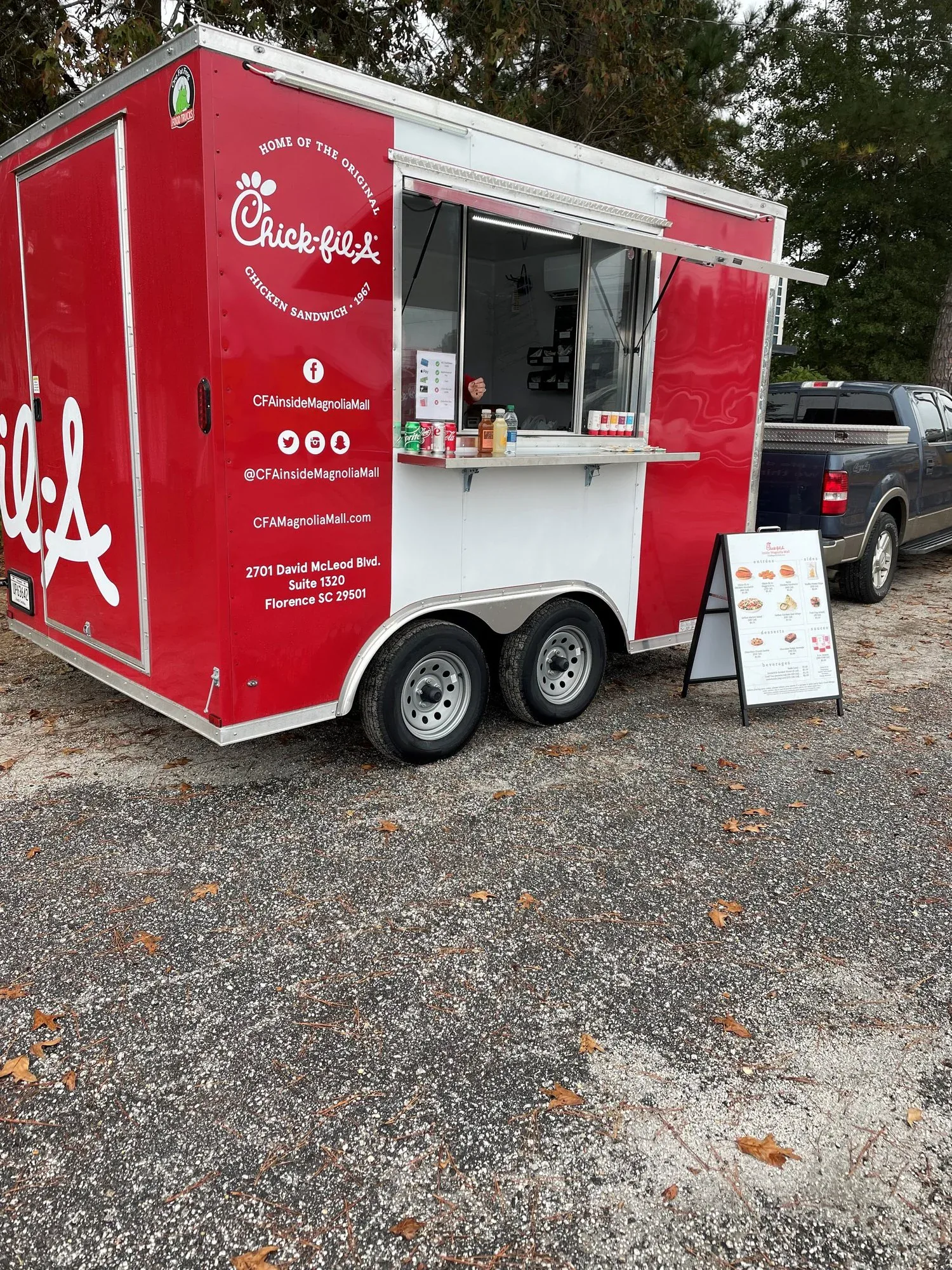 The Magnolia Mall Chick-fil-A trailer serving a community event